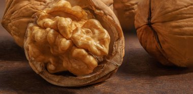 Ripe Walnuts on a wooden table.  Walnut fresh nuts Background top vie