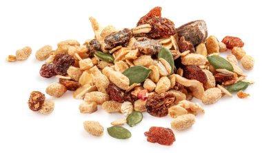 Nuts and seeds isolated over the white background. Creative layout made of granola or muesli Flat lay.