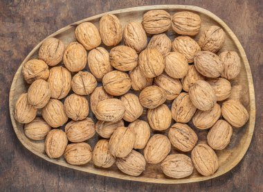  Walnuts on a wooden table.  Walnut fresh nuts Background top vie