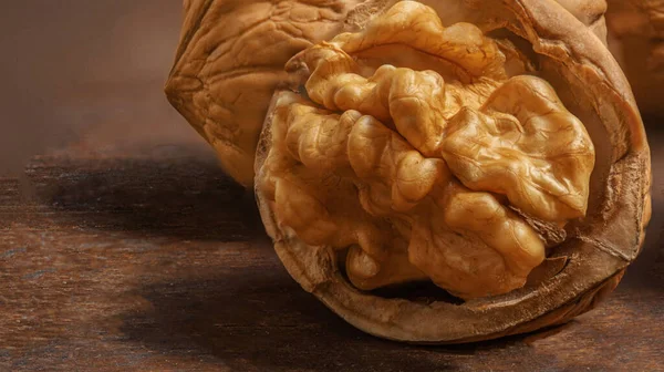  Walnuts on a wooden table.  Walnut fresh nuts Background top vie