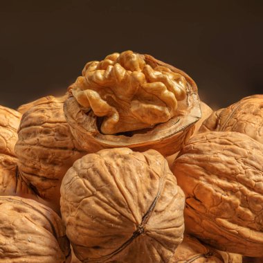 Walnuts kernels as a background, copyspace. Whole walnut close up, organic  food concep