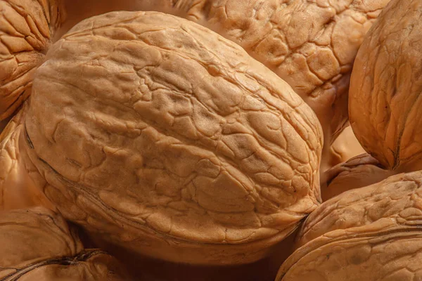 Walnuts kernels as a background, Whole walnut close up, organic  food concep