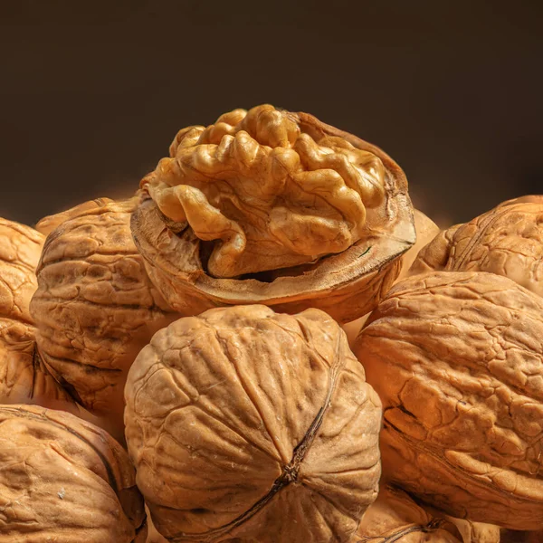 Walnuts kernels as a background, copyspace. Whole walnut close up, organic  food concep