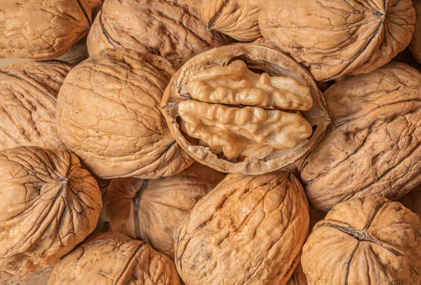 Walnuts kernels as a background, Whole walnut close up, organic  food concep