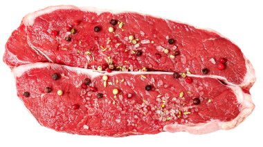 Fresh beef steak isolated on white background, top view. Raw meat fillet with spices and herb