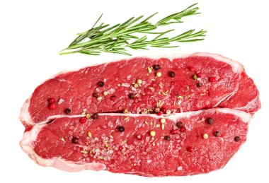 Fresh beef steak isolated on white background, top view. Raw meat fillet with spices and rosemary herb