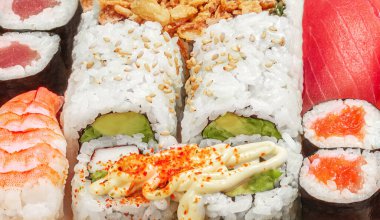 Sushi Pattern. Sushi set with rice, salmon  and shrimps top view. Japan restaurant menu
