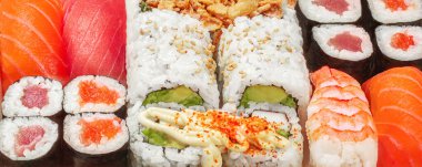  Sushi rolls set as a background. Japan restaurant menu. Sushi with salmon, tuna and avocado. T