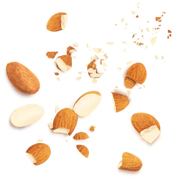Almond with crumbs isolated on the white background. Almond s nuts pieces top view. Flat lay