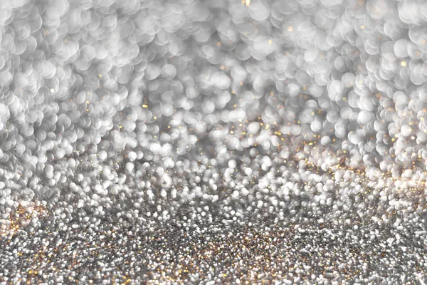 Silver och gyllene glitter bokeh bakgrund — Stockfoto