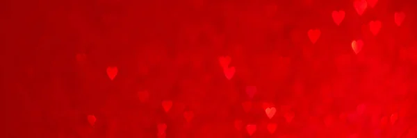 Červená srdce bokeh záhlaví pozadí — Stock fotografie