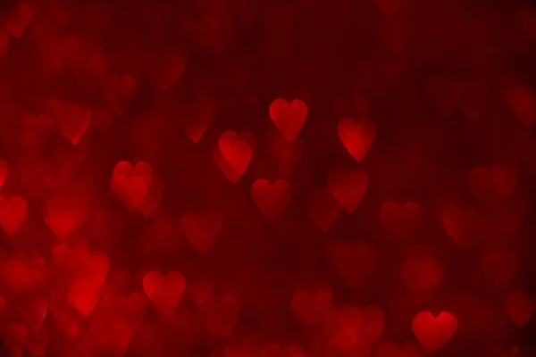 赤いハート キラキラしたボケの背景 バレンタインデーの抽象的な焦点を当てたテクスチャ — ストック写真