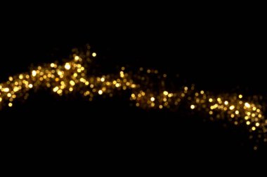 Siyah arka planda altın bulanık bokeh ışıkları. Kutlamak için ışıldayan yıldızlar. Tasarımınız için üstüste
