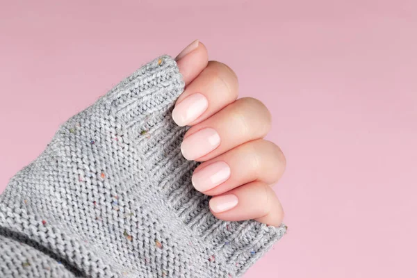 Female Hand Gray Knitted Sweater Beautiful Natural Manicure Pink Nude — Stockfoto