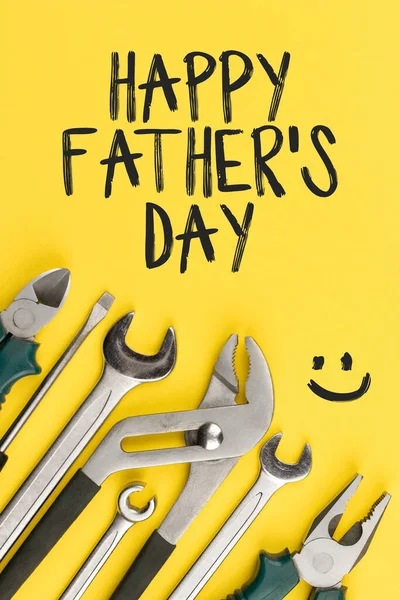 Work tools on yellow background. Happy fathers day concept —  Fotos de Stock