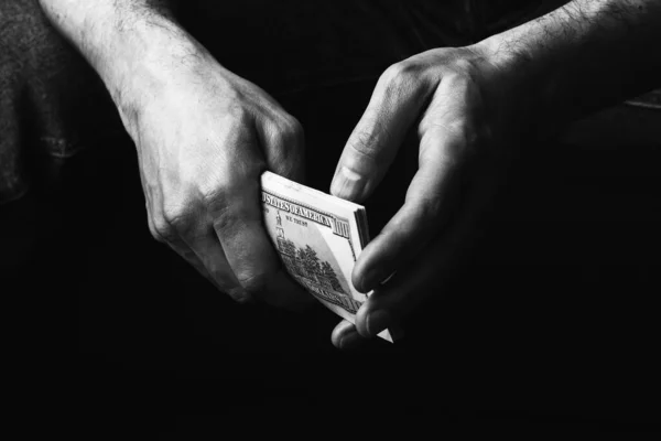 Male hands holding us hundred dollars banknotes — Stock fotografie