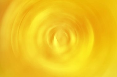 Bulanık radyal hareket parlak sarı arkaplan. Soyut dairesel doku