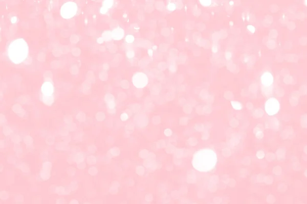 Pink sparkling glitter bokeh background, abstract defocused lights texture