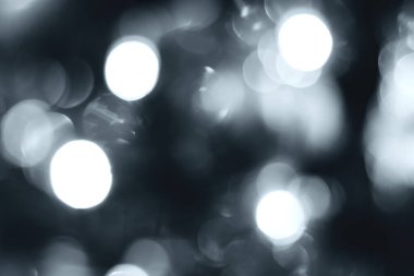 Blurred lights, gray, deep blue background. Abstract bokeh with soft light