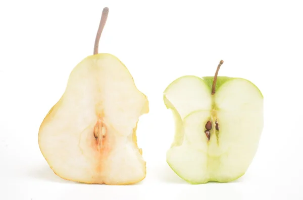 Bitten apple and pear cut in half — Stock Photo, Image