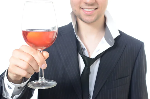 Joven empresario bebiendo vino — Foto de Stock