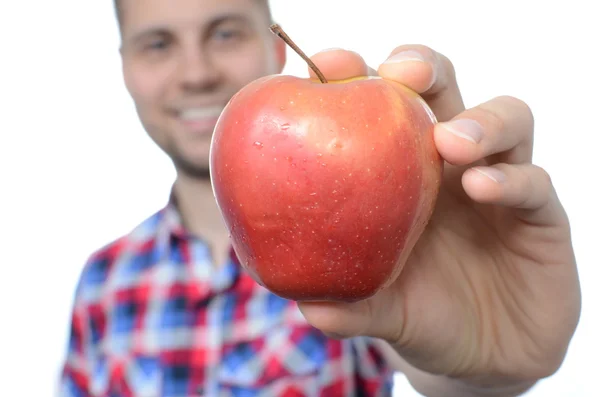 Young smiling man with fresh apple — Stock Photo, Image