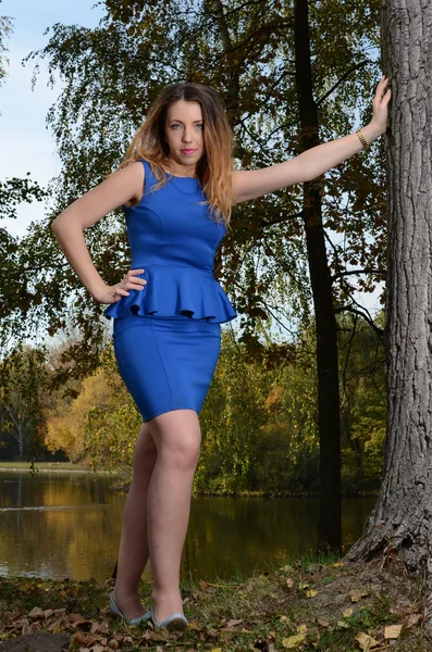 Pretty young woman in blue dress — Stock Photo, Image