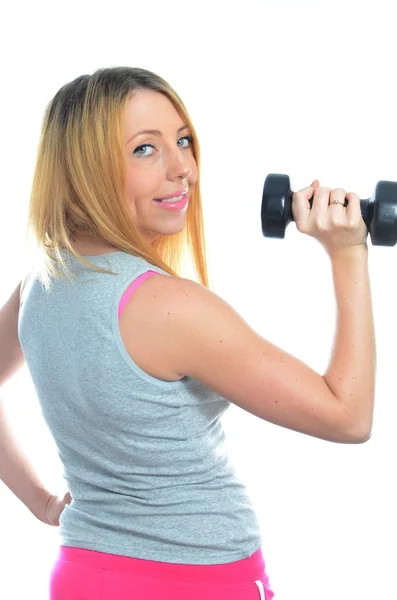 Jonge vrouw doet oefening — Stockfoto