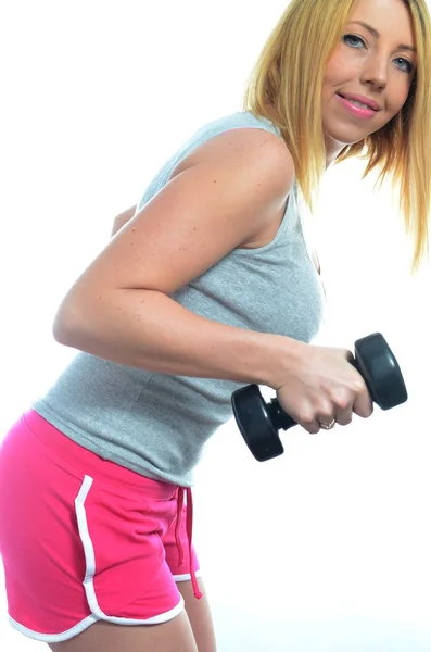 Mujer joven haciendo ejercicio — Foto de Stock