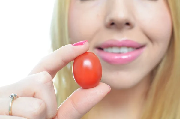 Young woman with healthy tomato — Stock Photo, Image