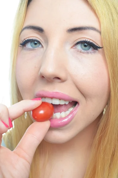 Young woman with healthy tomato — Stock Photo, Image