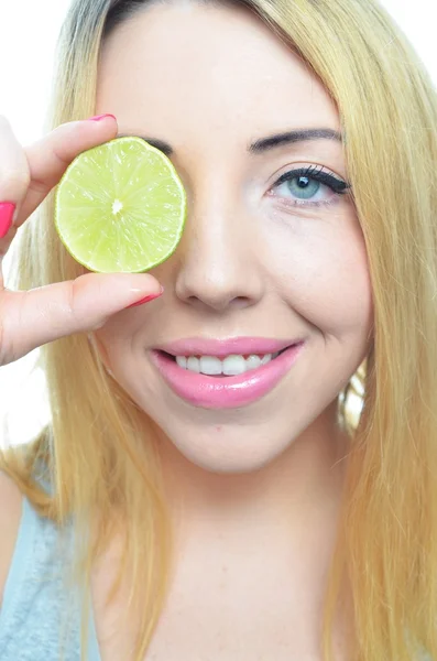 Young woman with sliced lime — Stock Photo, Image