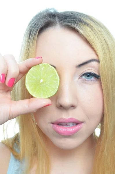 Young woman with sliced lime — Stock Photo, Image