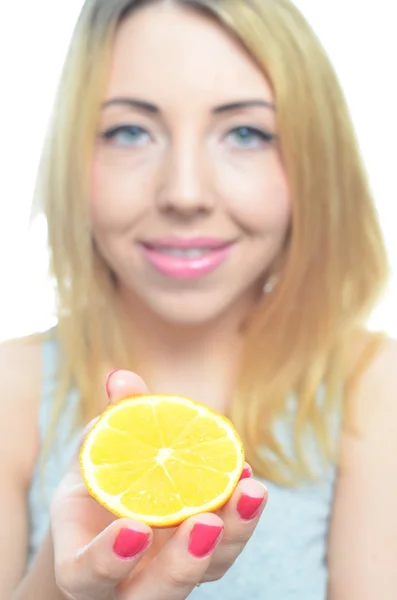 Young woman with orange slice — Stock Photo, Image