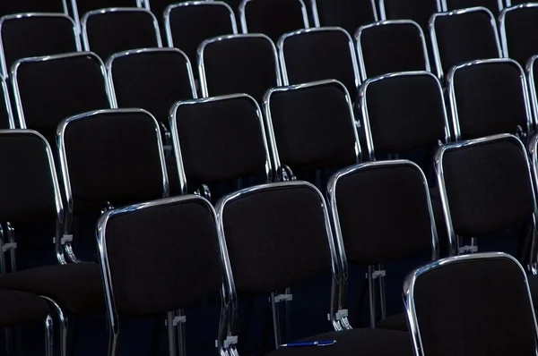 Rows black business chairs — Stock Photo, Image