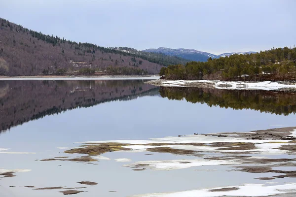 stock image Spring in Norway, view of the melting snow at the lake Vaavatnet located in Trondelag