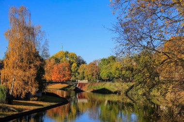 Indian summer in Riga, the capital of Latvia. View of the city channel with National Opera building reflecting  in the water