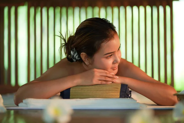 Happy Young asia woman line down on floor getting body massage and spa service