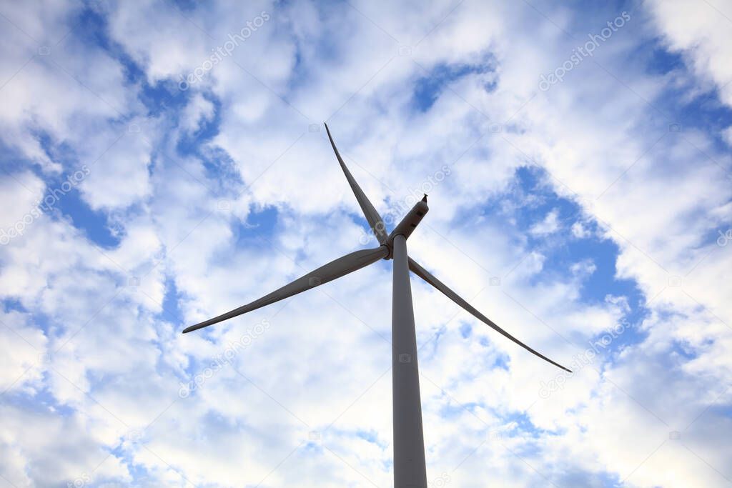 Wind Turbine generate electrical power, Green energy and environment concpet, Wind turbine on whiet blue sky