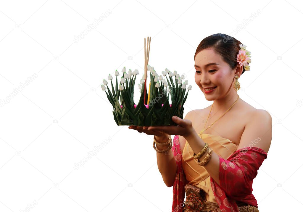 Joyful Asia woman lift Kra-Thong up to pray respect to Goddess of water on November, Loy krathong festival in Thaland