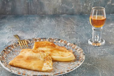 Crepe Suzette pancakes with cognac and citrus sauce.