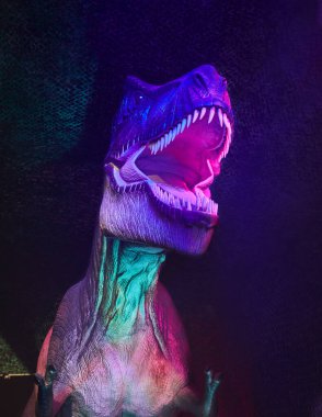 Life-size dinosaur figure in the park is an approximation to reality.