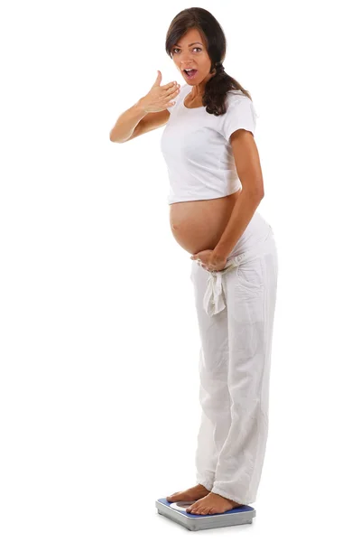 Portrait of a pregnant woman is weighed — Stock Photo, Image