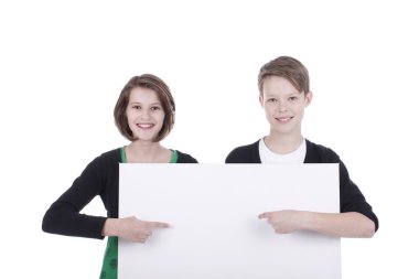 Portrait of a boy and a girl with a white placard