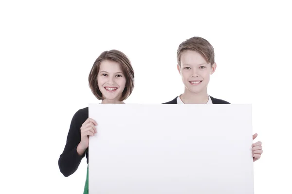 Portrait of a boy and a girl with a white placard — Stok fotoğraf