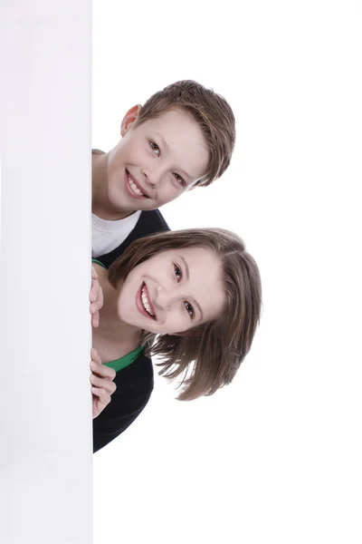 Portrait of a boy and a girl with a white placard — Stok fotoğraf