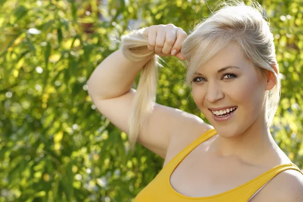 Attractive woman tears her ponytail — Stock Photo, Image