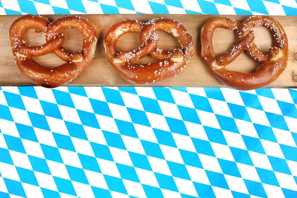 Bavarian pretzels on checkered background — Stock Photo, Image