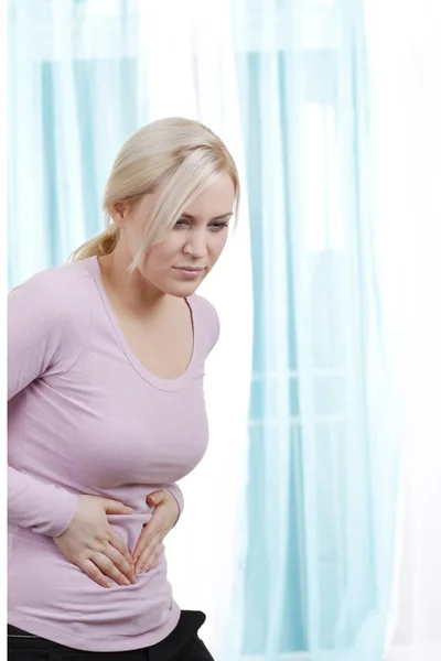 Woman with abdominal pain — Stock Photo, Image