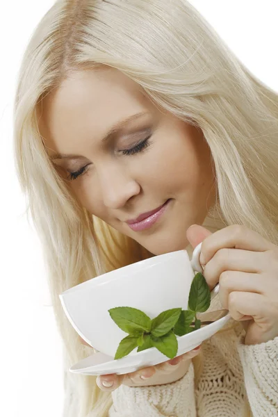 Happy woman drinking a cup of tea — Stock Photo, Image